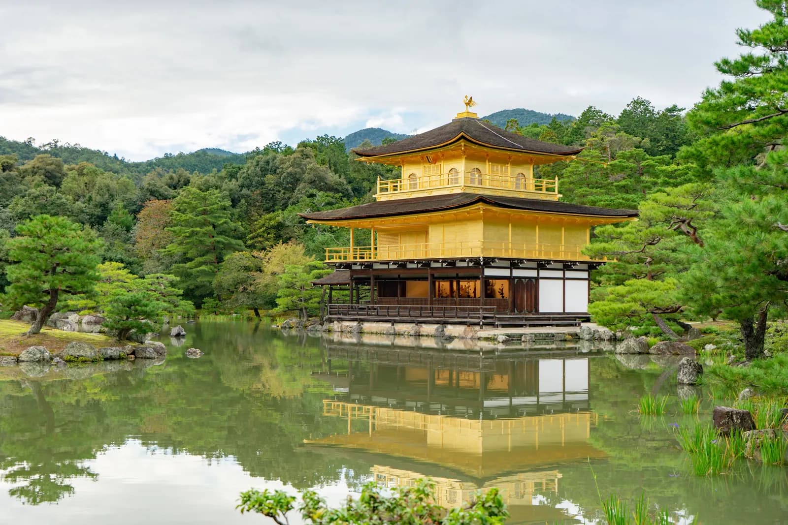 Kinkaku-ji, the golden pavilion in Kyoto, reflected in the pond in front of it