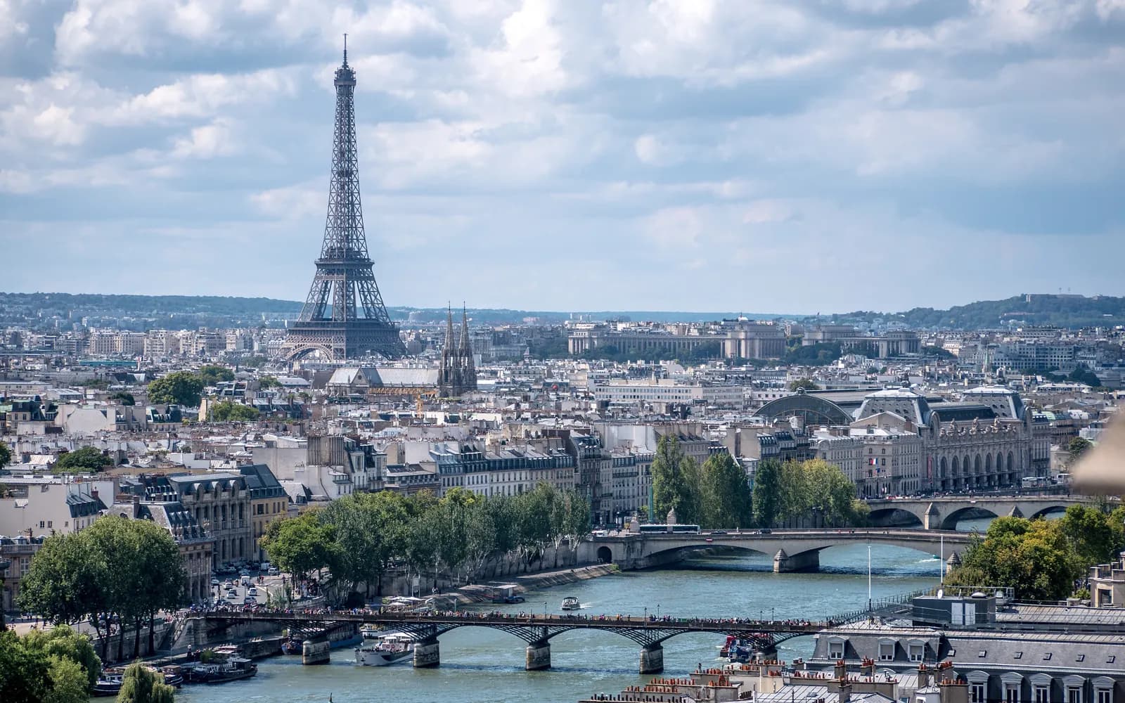 The Eiffel Tower rising above the rooftops of Paris